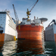Illustration for article titled Here's The Largest Oil Rig Ever On Top Of The Largest Transport Ship